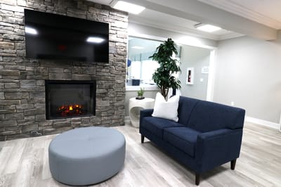 Cozy lounge area with a fireplace and seating