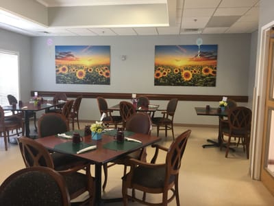 Dining area with sunflower decor and tables