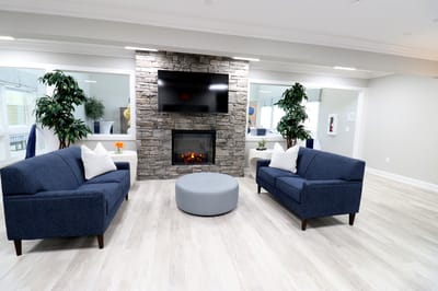 Interior of a cozy common area with a fireplace