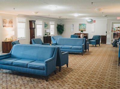 Common area with blue sofas and a resident
