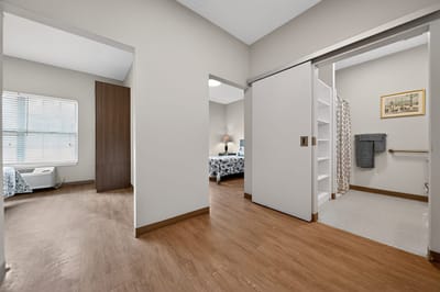 A view of a resident room with an attached bathroom