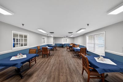 Bright dining room with tables set for meals