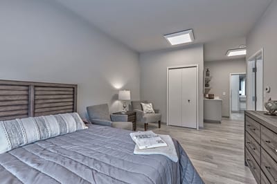 A well-furnished bedroom in a senior living facility