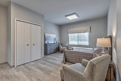 Cozy resident room with furniture and natural light