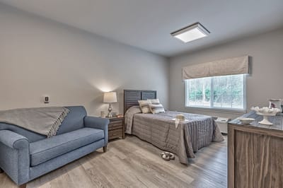 Cozy private room with bed and seating area
