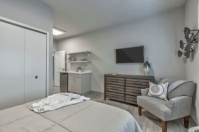 Cozy resident room with a bed and TV