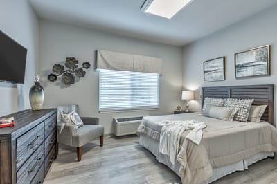 A cozy private resident room with furnishings