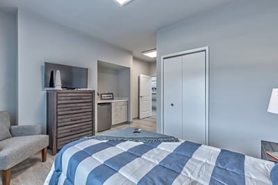 Interior view of a resident room with a bed and furniture