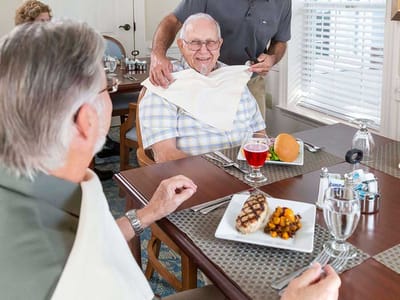 Residents enjoying a meal in the dining room