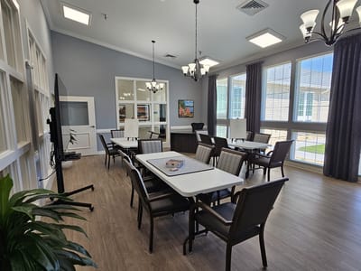 Bright common area with tables and chairs