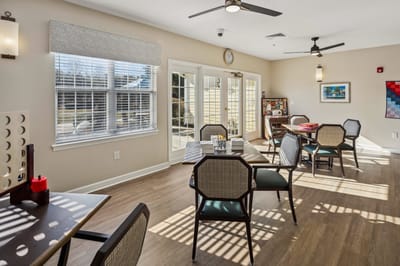 Bright common area with tables and chairs