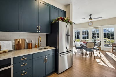 Bright kitchen area with dining space and outdoor view