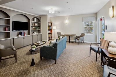 Bright common area with seating and bookshelves