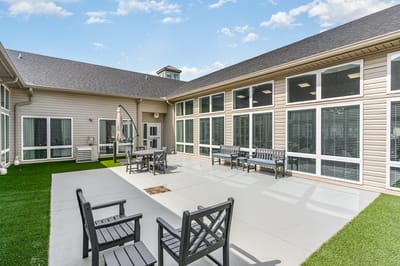 Outdoor seating area with benches and tables