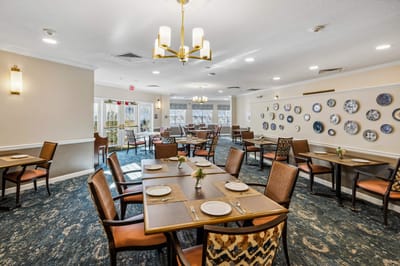 Bright dining room with tables set for meals