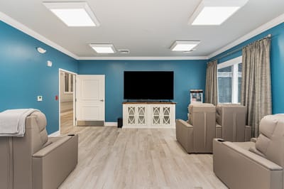 Bright common area with seating and TV