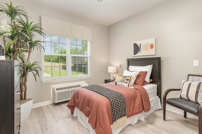 Cozy resident room with a bed and natural light