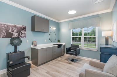 A bright interior salon area with styling chairs