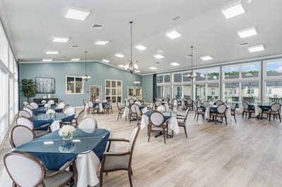 Bright dining area with tables and chairs