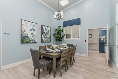Elegant dining area with a large table and blue decor