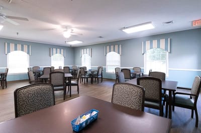 Bright dining room with tables and chairs