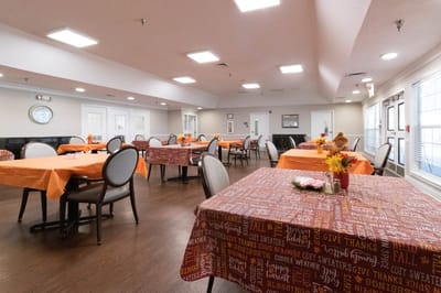 Bright dining area with orange tables and decorations