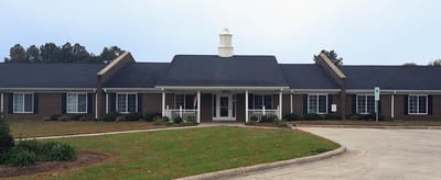 Wilson House, assisted living in Wilson, NC — Senior living facility with brick exterior and manicured landscaping