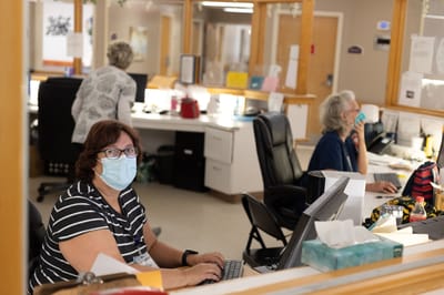Staff at the reception area assisting residents