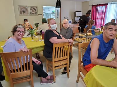 Residents enjoying a meal in the dining area