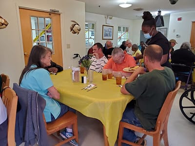 Residents dining in a communal dining area