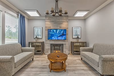 A cozy common area with comfortable seating and decor