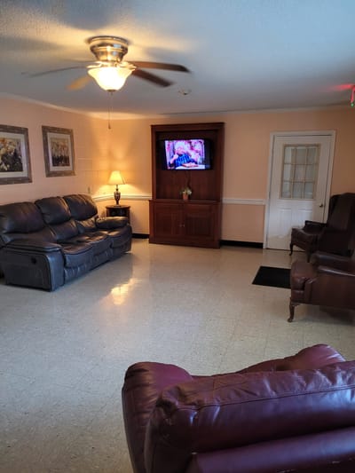 Interior lounge area with seating and a television