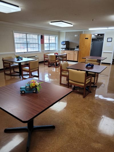 Interior view of a common room with tables and chairs