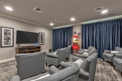 Cozy lounge area with popcorn machine and seating arrangement