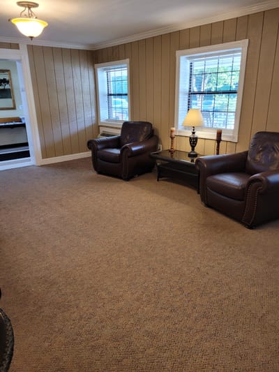 Cozy common area with seating and natural light