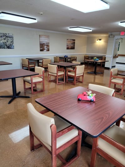 Tables and chairs arranged in a common area