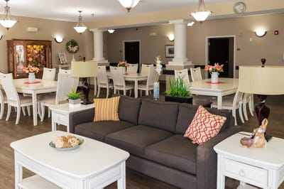 Common area with seating and tables in a bright setting