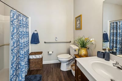 Bright and clean resident bathroom with amenities