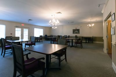 Interior view of a common area with tables and chairs