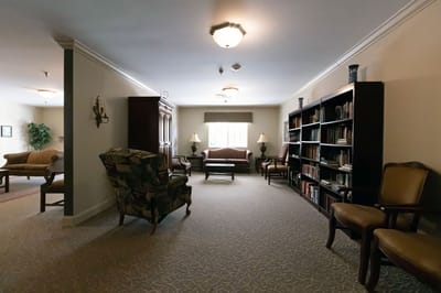 Interior common area with seating and bookshelves