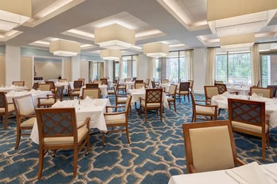 Elegant dining room setup with tables and chairs