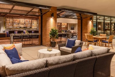 Outdoor common area with comfortable seating and bar