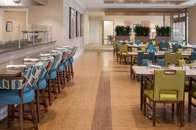 Bright dining area with colorful seating