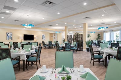 Bright dining room with tables set for meals