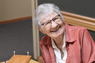 Resident smiling during an activity session