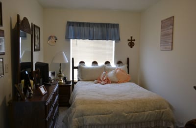 Cozy private resident room with bed and decorations