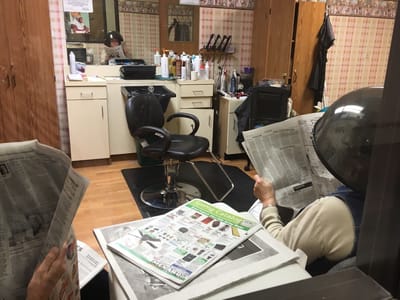 Residents enjoying hair treatments in the salon