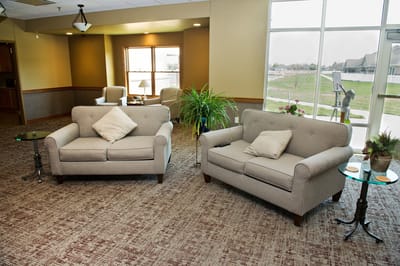 Common area with seating in a well-lit lobby