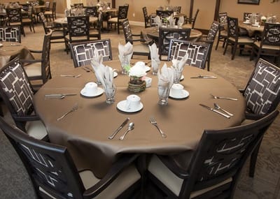 Elegant dining room setup with tables and chairs