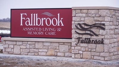 Facility sign displaying name and services